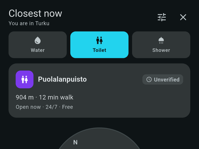 Compass mode pointing at the nearest toilet, 904 metres away and open 24/7.